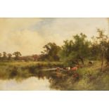 Henry H Parker (1858-1930)A RIVER LANDSCAPE WITH CATTLE WATERING AND HAYMAKERS IN THE DISTANCESigned