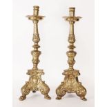 A pair of heavy cast brass candlesticks,20th century in the 17th century manner, the turned