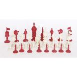 A Chinese ivory chess set,mid-19th century, with engine turned and carved decoration, red stained