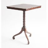 A Victorian mahogany tripod table,the rectangular snap top on a bobbin-turned column and scrolled