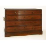 A mahogany table cabinet,19th century, with four long drawers and brass carrying handles on a shaped