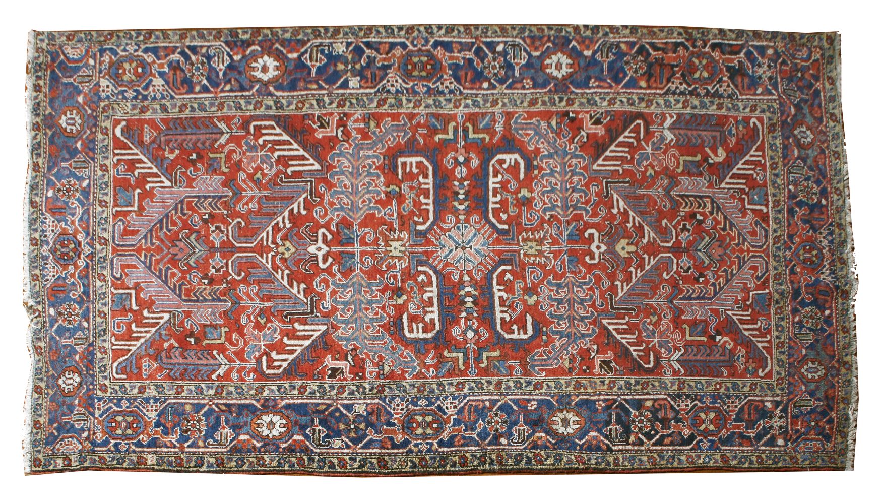 An Heriz carpet, North-West Persia, the brick red field with a central medallion within an indigo