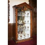 A Biedermeier-style burr maple, glass-fronted and mirror-backed display cabinet,20th century, the