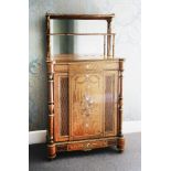 An exhibition quality single door satinwood cabinet,mid-19th century, the raised back with a three-