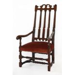 A 17th century-style stained wood elbow chair,19th century, with a high back, downswept arms and