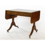 A Regency mahogany sofa table,the drop-leaf top with 'plum pudding' veneer and broad crossbanding