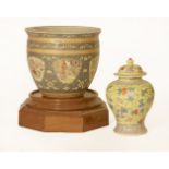 A modern Chinese porcelain jardinière,a similar vase and cover, anda large modern wooden plinth,