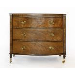 A pair of mahogany three-drawer bow front chests,early 19th century, the drawers with ebony edging