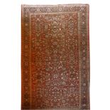 A Mahal carpet,North-West Persia, c.1900, the red ground with a central panel and all-over scrolling
