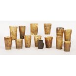 Thirteen horn tumblers,18th/19th century, all with engraved or scratch carved scenes, including