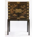 A Chinese lacquered two-door cabinet,18th century, on an associated stand,95cm wide51cm deep149.