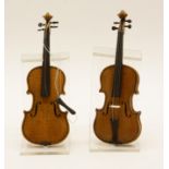 Two model violins, on purpose made perspex stands, 14cm high