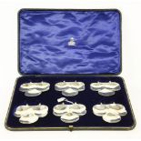 A cased set of six silver clover leaf dishes, with suspension brackets, by Hilliard & Thomason,