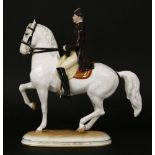 A Vienna porcelain figure of a Spanish Riding School horse and rider, damage to ear, 24.5cm high