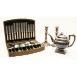 An cased canteen of cutlery, a silver plated teapot and a pair of silver plated candlesticks