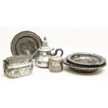 A collection of six Persian silver plated dishes, together with an Indian white metal jar and cover,