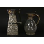 Two silver-plated claret jugs, one with an ovoid faceted body, 22cm high, the other of cut glass,