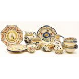 A collection of Quimper pottery, comprising: four plates, four bowls, four vases, a flower block and