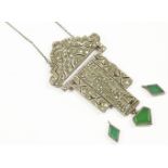 An Art Deco silver marcasite set pendant centrepiece, c.1930, with green paste stone plaque drops (