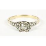 A gold single stone illusion set cushion cut diamond ring, marked 9ct and PLAT, size Q2.66g