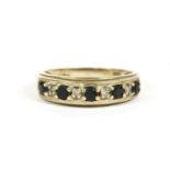 A 9ct gold sapphire and diamond half eternity ring, round cut sapphire and eight cut diamond claw