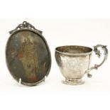 A French silver cup, with scrolling handle to one side and engraved foliate banded decoration and