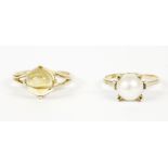 A 9ct gold single stone amber ring, and a gold single stone cultured pearl ring, marked 18k (