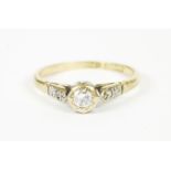 A gold single stone diamond ring, with diamond set shoulders, size L1.93g