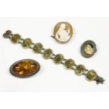 A gold shell cameo brooch, depicting a young maiden with crucifix, mount marked 9ct, an amber