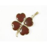 A 9ct gold garnet and white stone shamrock or four leafed clover pendant, 2.08g