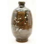 A studio pottery vase, by Jim Malone, of baluster form with a narrow neck, with impressed mark to