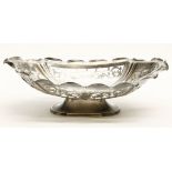 A Victorian silver embossed and pierced basket, with flowerhead and foliage decoration within a