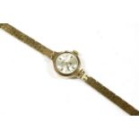 A ladies 9ct gold Rotary mechanical bracelet watch, with raised gilt and black baton markers to an