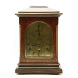 A mantel clock, with an arched brass dial, with strike/silent, 41cm high