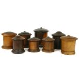 A collection of eight treen string boxes, 19th century, all turned in various woods, 20cm highest (