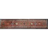 A 20th century Persian runner, together with two Persian mats, 75cm x 390cm x 84cm and 108cm x