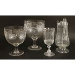 Two large late Victorian clear glass bowls, on plain stems and feet, engraved with trailing fruiting