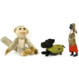 A Norah Wellings monkey, and two Schuco clock work toys, a Scottie dog, and a mouse