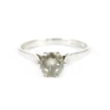 A single stone diamond ring marked 18ct, estimated as approximately 0.85ct, finger size L, 2.22g