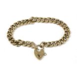 A 9ct gold hollow curb link bracelet with gold padlock, Birmingham, 12.36g