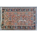 A small hand knotted Bokhara rug, the red fields with geometric decoration, 48 x 48 cm, together