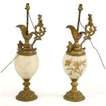 A pair of large Victorian gilt metal and opaline glass table lamps, in the form of ewers, 70cm high