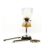 An oil lamp, two food thermometers and bodkins