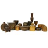 Fifteen treen items, 19th century and later, comprising string boxes, one with patron's twine boot