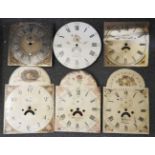 A box of six longcase clock dials, and a 30 hour movement