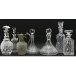 Seven various cut glass decanters, to include silver mounted examples