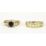 A 9ct gold oval cut sapphire and cubic zirconia set ring, and a 9ct gold two row channel set