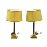 A pair of Corinthian column brass table lamps and shades