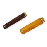 Two cased amber cheroot holders, with a 9ct gold mount, both in original boxes, 13.39g