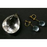 A faceted rock crystal pendant, and a pair of faceted blue paste stone drop earrings